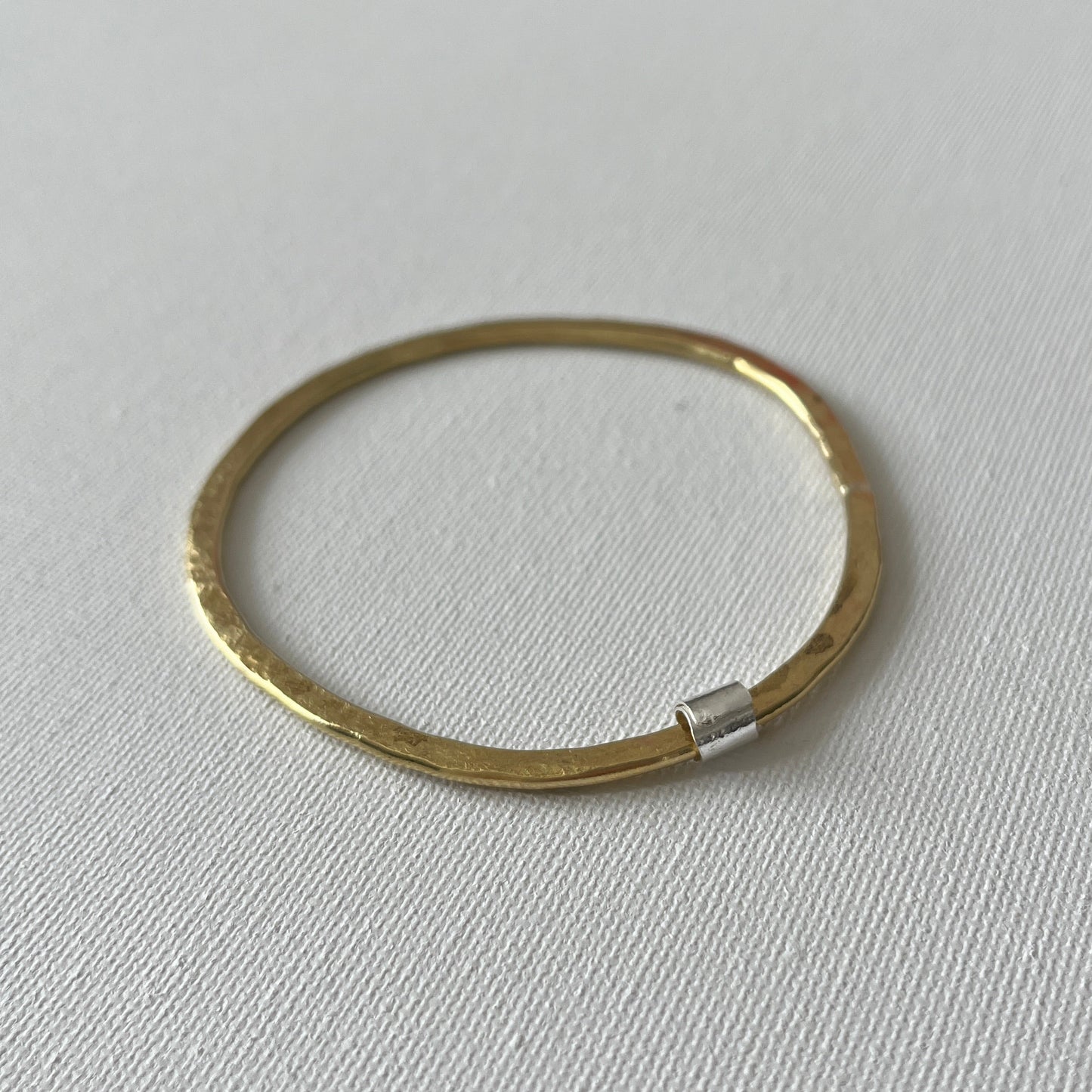 Hammered Brass Bangle with Silver Ripcurl Charm