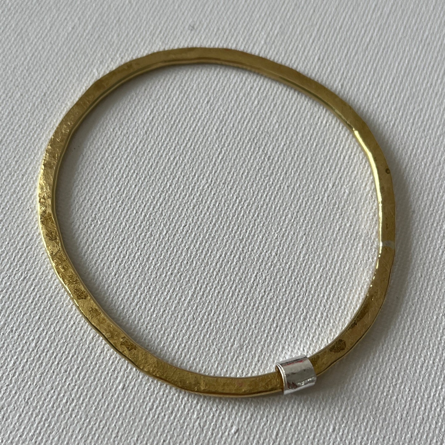 Hammered Brass Bangle with Silver Ripcurl Charm