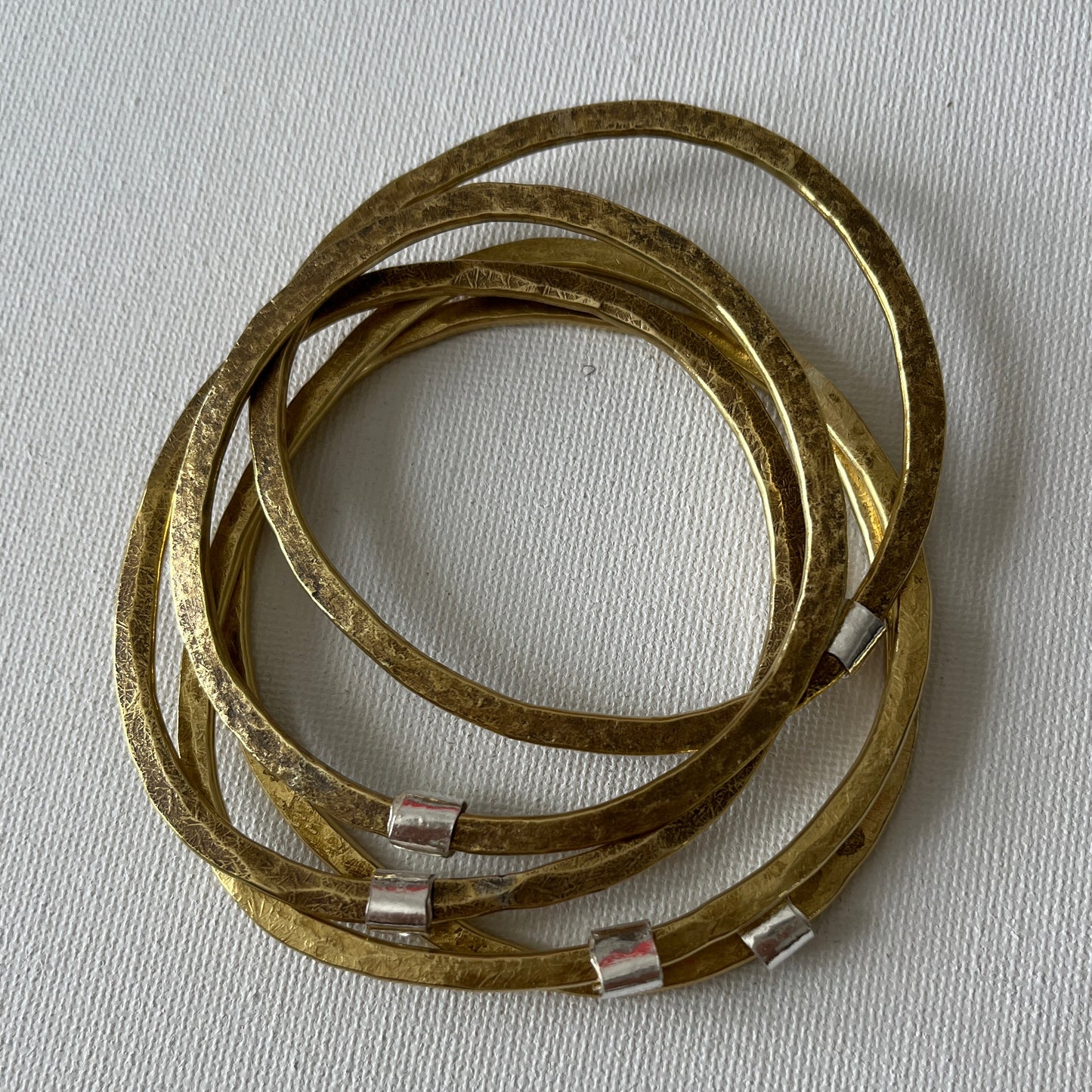 Hammered Brass Bangle with Silver Ripcurl Charm