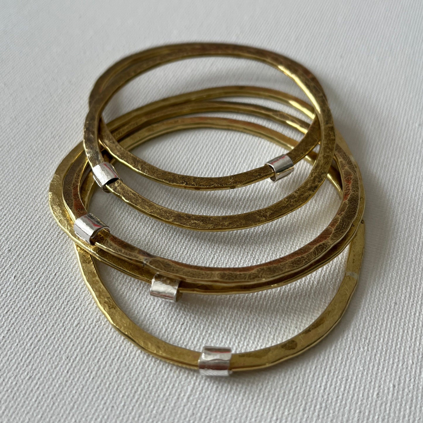 Hammered Brass Bangle with Silver Ripcurl Charm