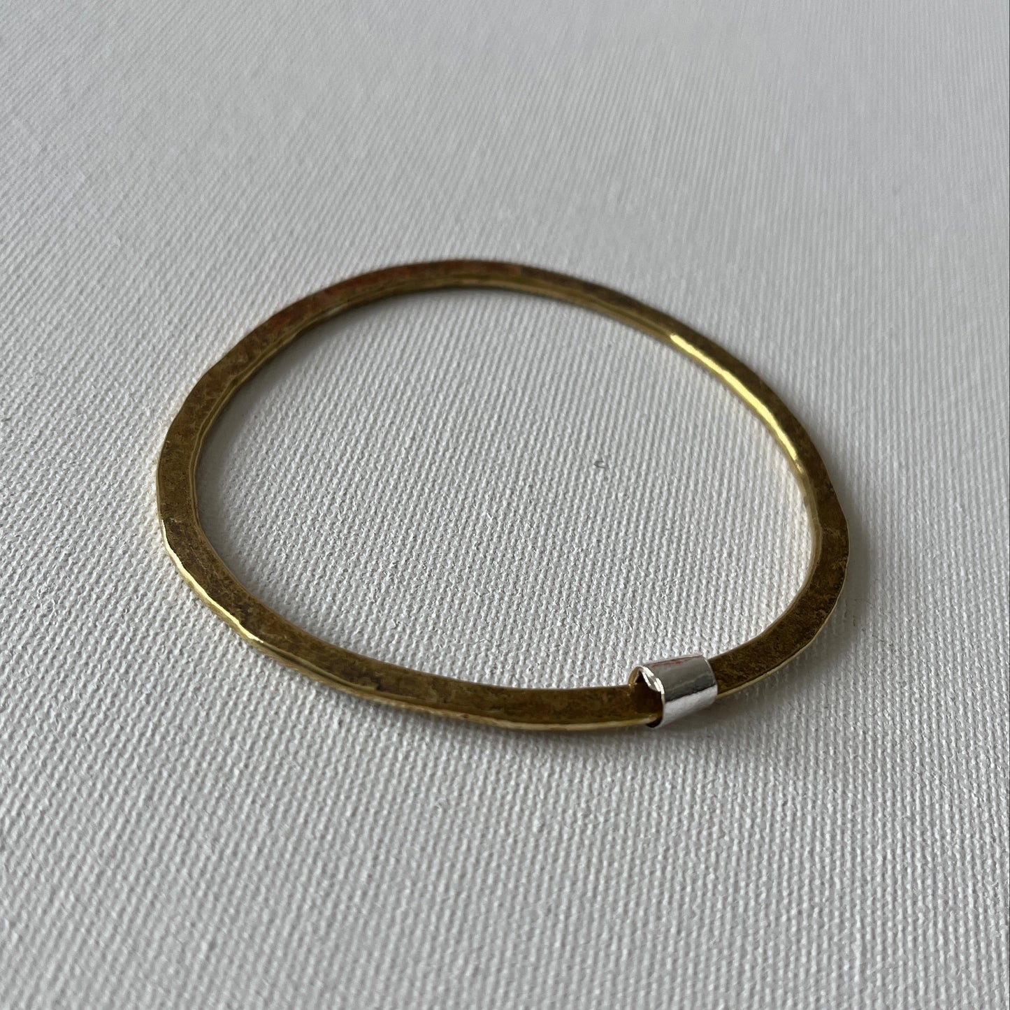 Hammered Brass Bangle with Silver Ripcurl Charm