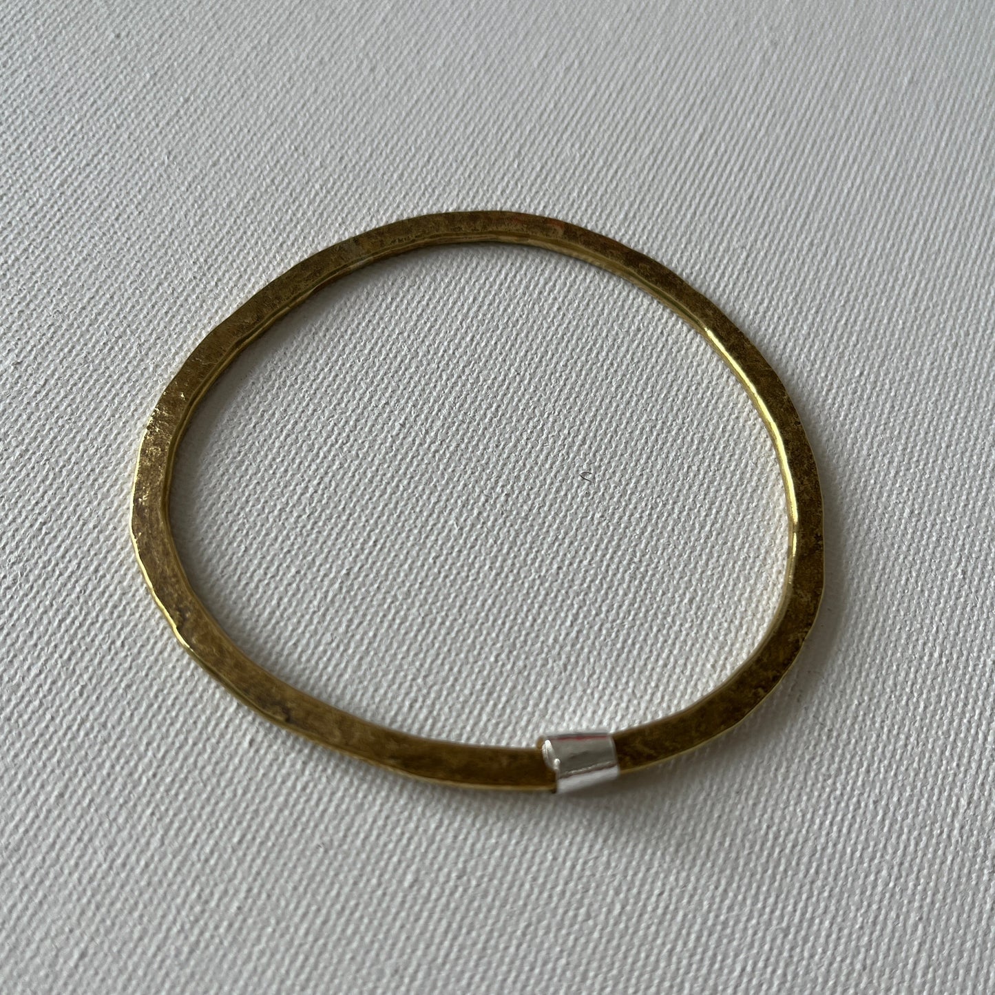 Hammered Brass Bangle with Silver Ripcurl Charm